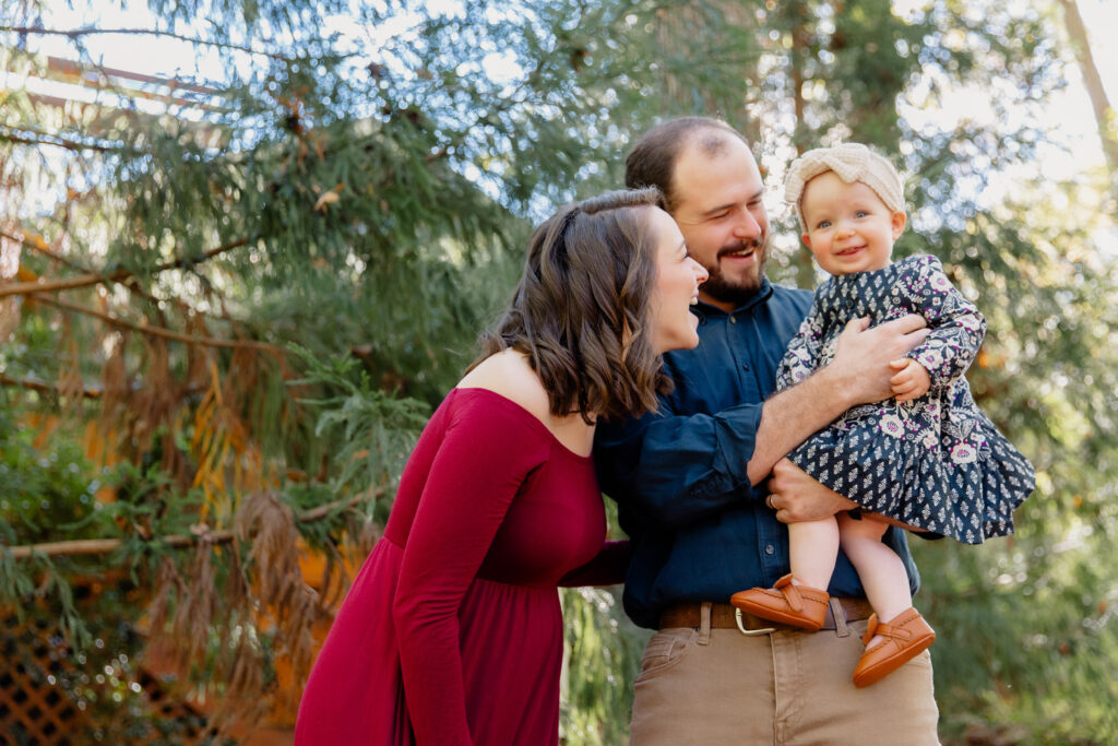 happy family smiling in maternity photos